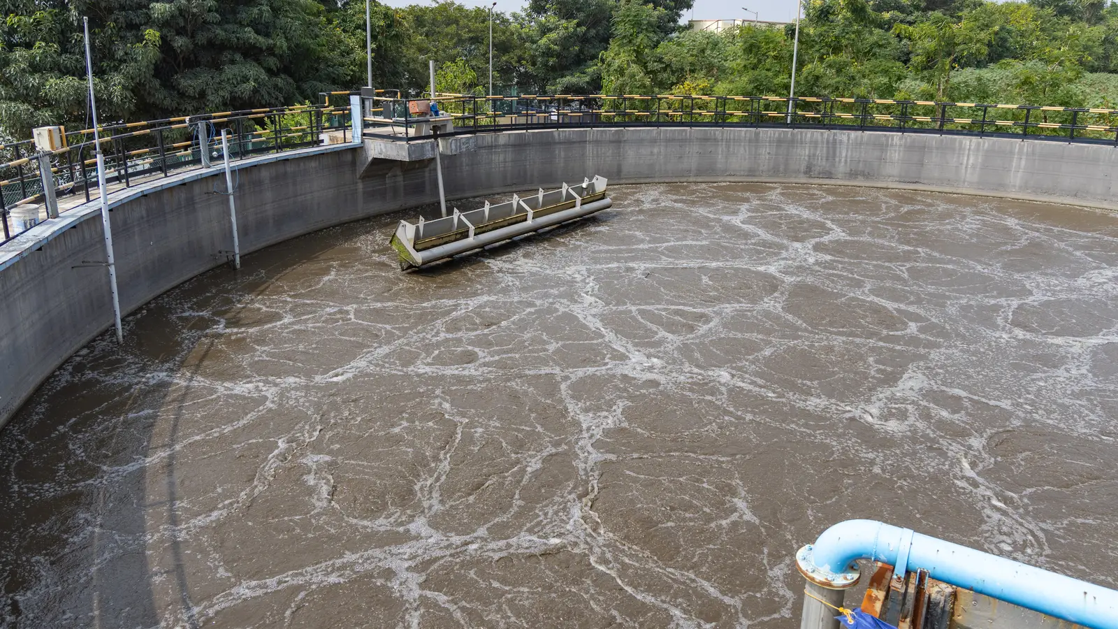 Circular aeration basin at a municipal wastewater treatment plant with active surface turbulence